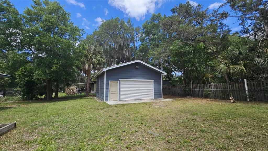 36850 Haynes Road Fruitland Park, FL 34731 - Photo 22 of 28 a front view of house with a yard and trees