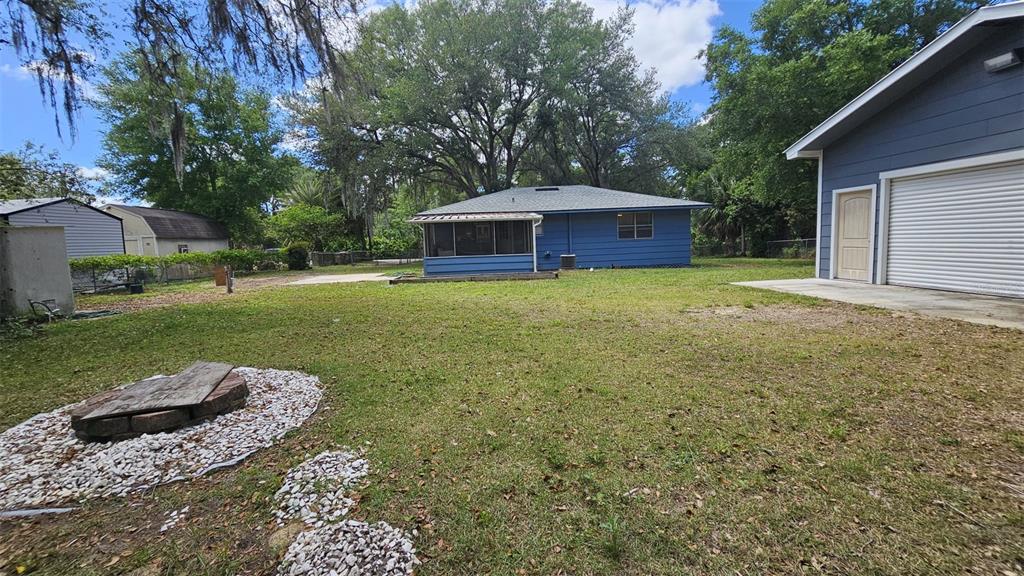 36850 Haynes Road Fruitland Park, FL 34731 - Photo 23 of 28 a view of a house with backyard and garden