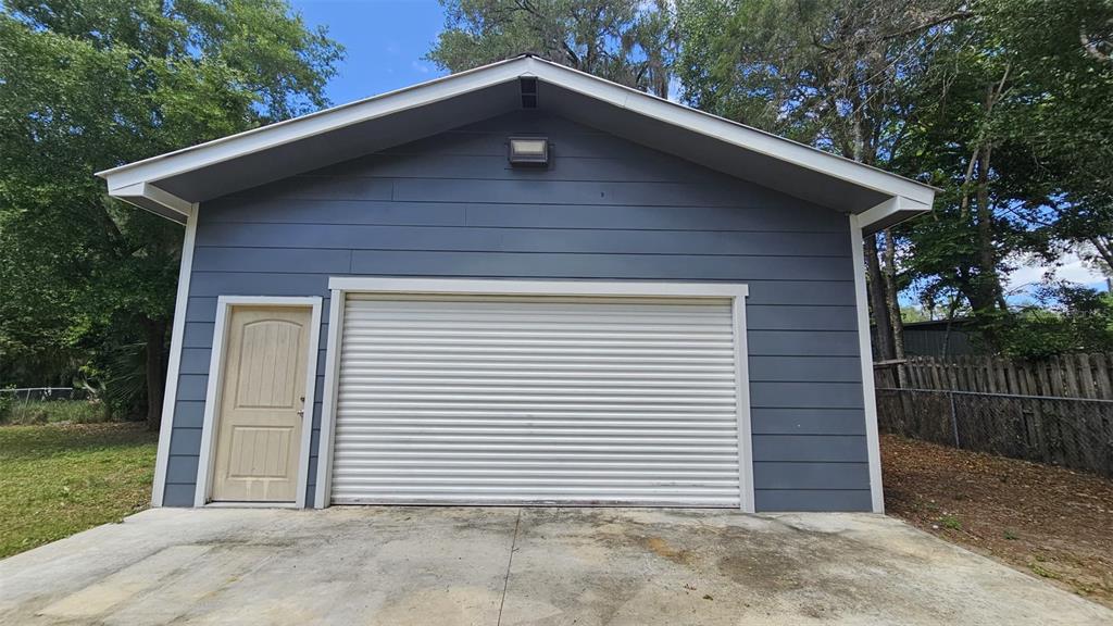 36850 Haynes Road Fruitland Park, FL 34731 - Photo 24 of 28 a front view of a house with a garden