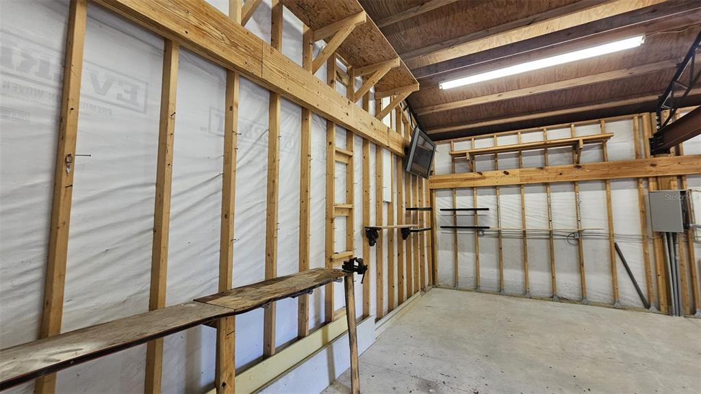 36850 Haynes Road Fruitland Park, FL 34731 - Photo 27 of 28 a view of staircase with railing and windows