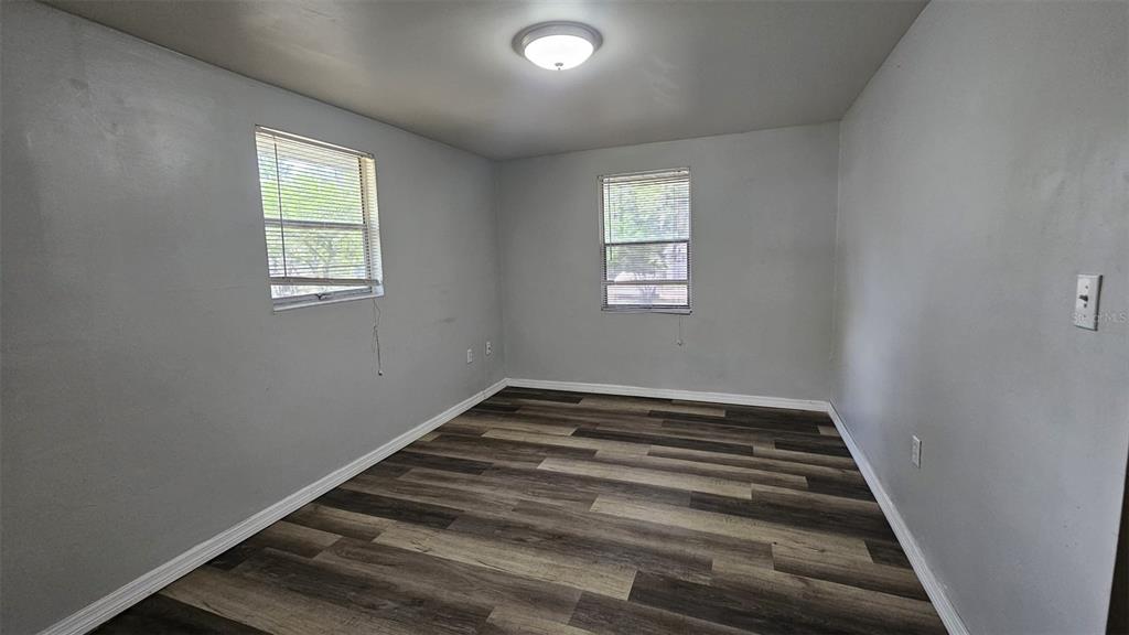 36850 Haynes Road Fruitland Park, FL 34731 - Photo 6 of 28 a view of an empty room and window