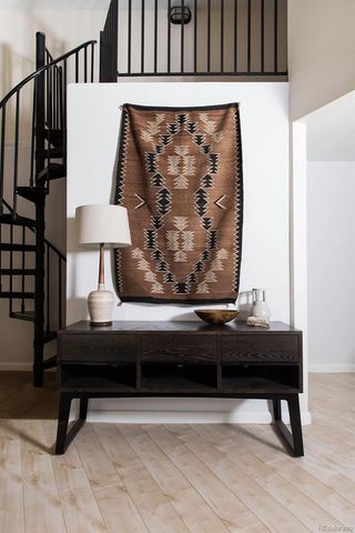 a view of wooden floor and chair in a room