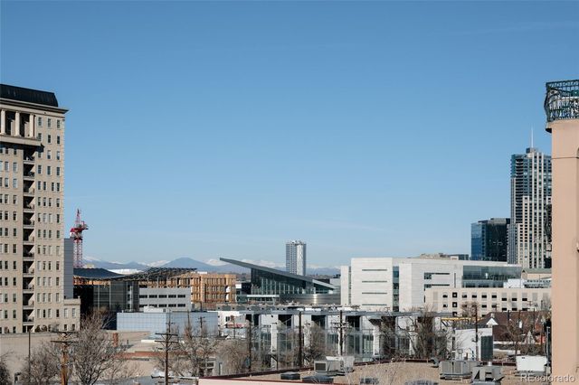 a view of city with tall buildings