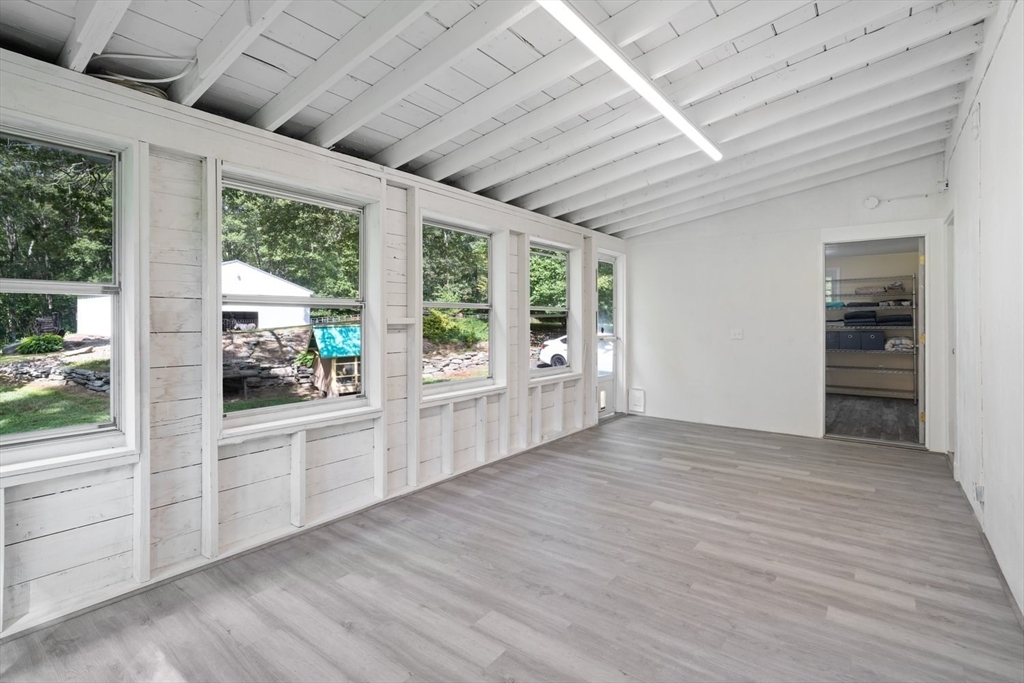 19 Hudson Road Oxford, MA 01540 - Photo 6 of 40 an empty room with wooden floor and windows