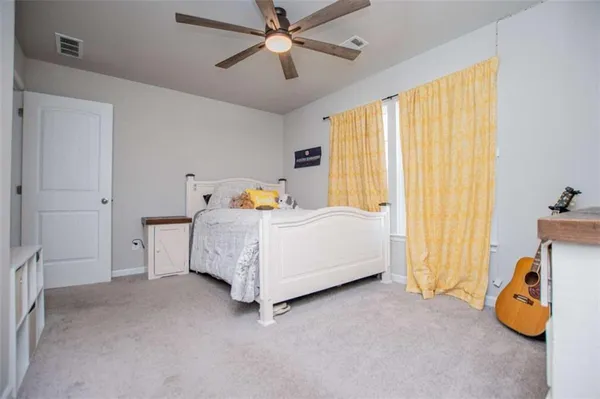 a bed room with a bed and a television