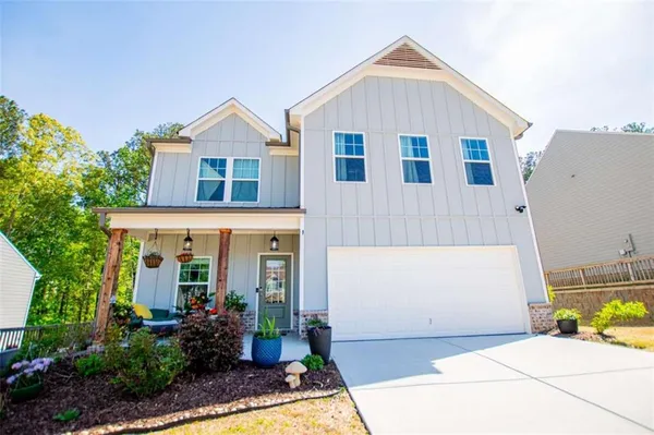 a front view of a house with a yard