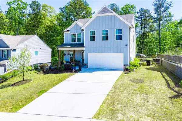 a view of house with yard outdoor seating area and entertaining space