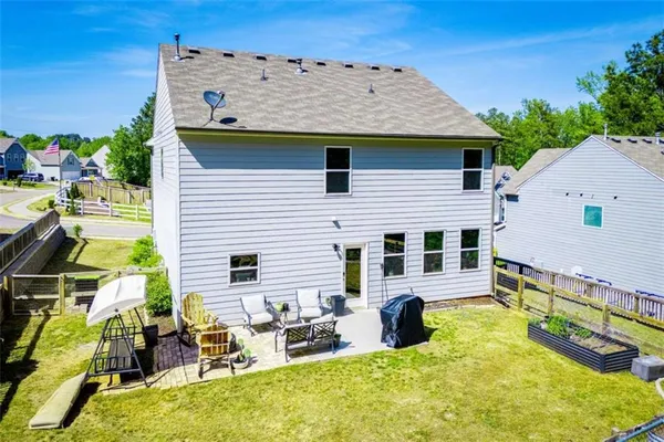 an aerial view of a house with a swimming pool