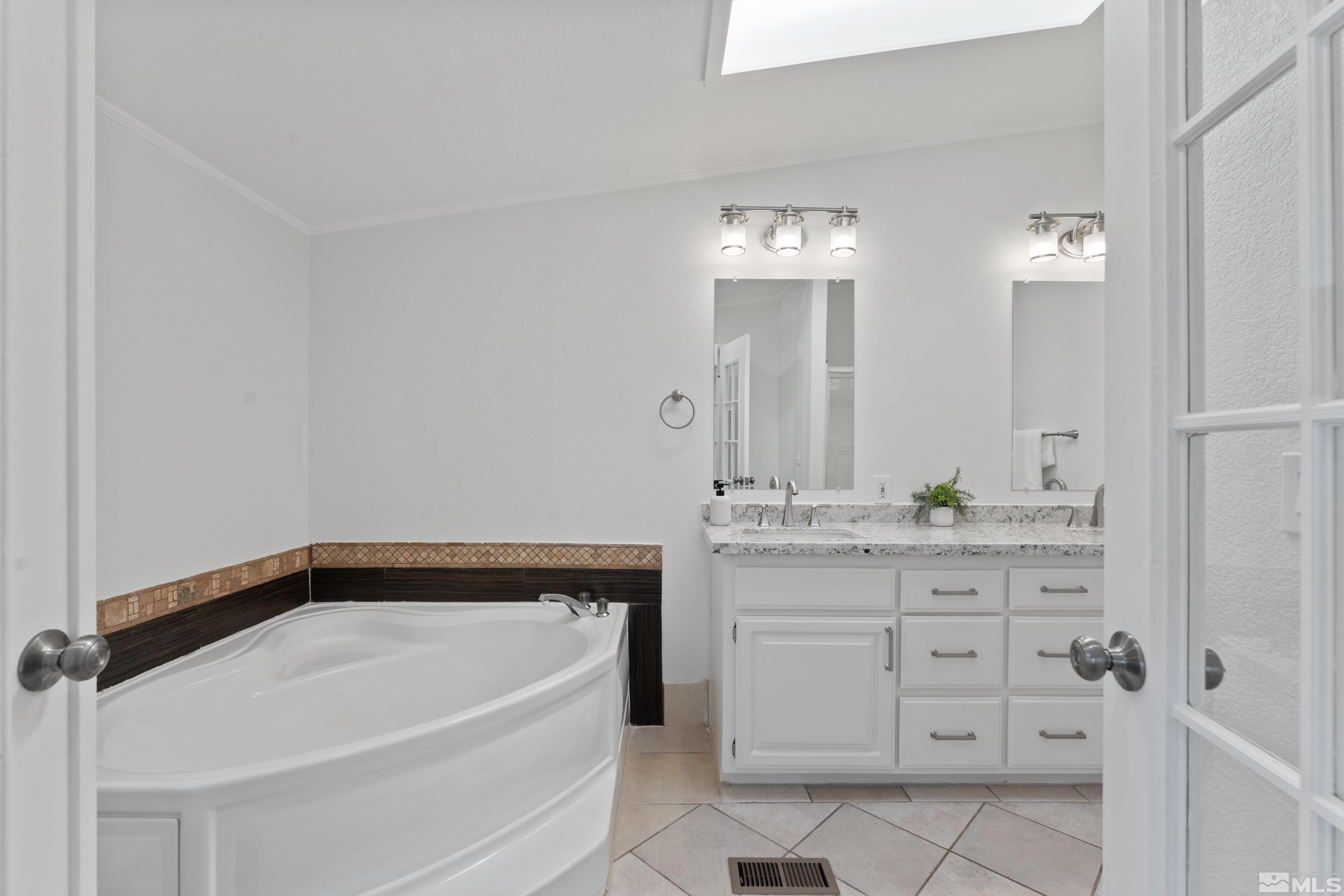 7640 Lytton Road Reno, NV 89506 - Photo 19 of 40 a bathroom with a bathtub and a sink
