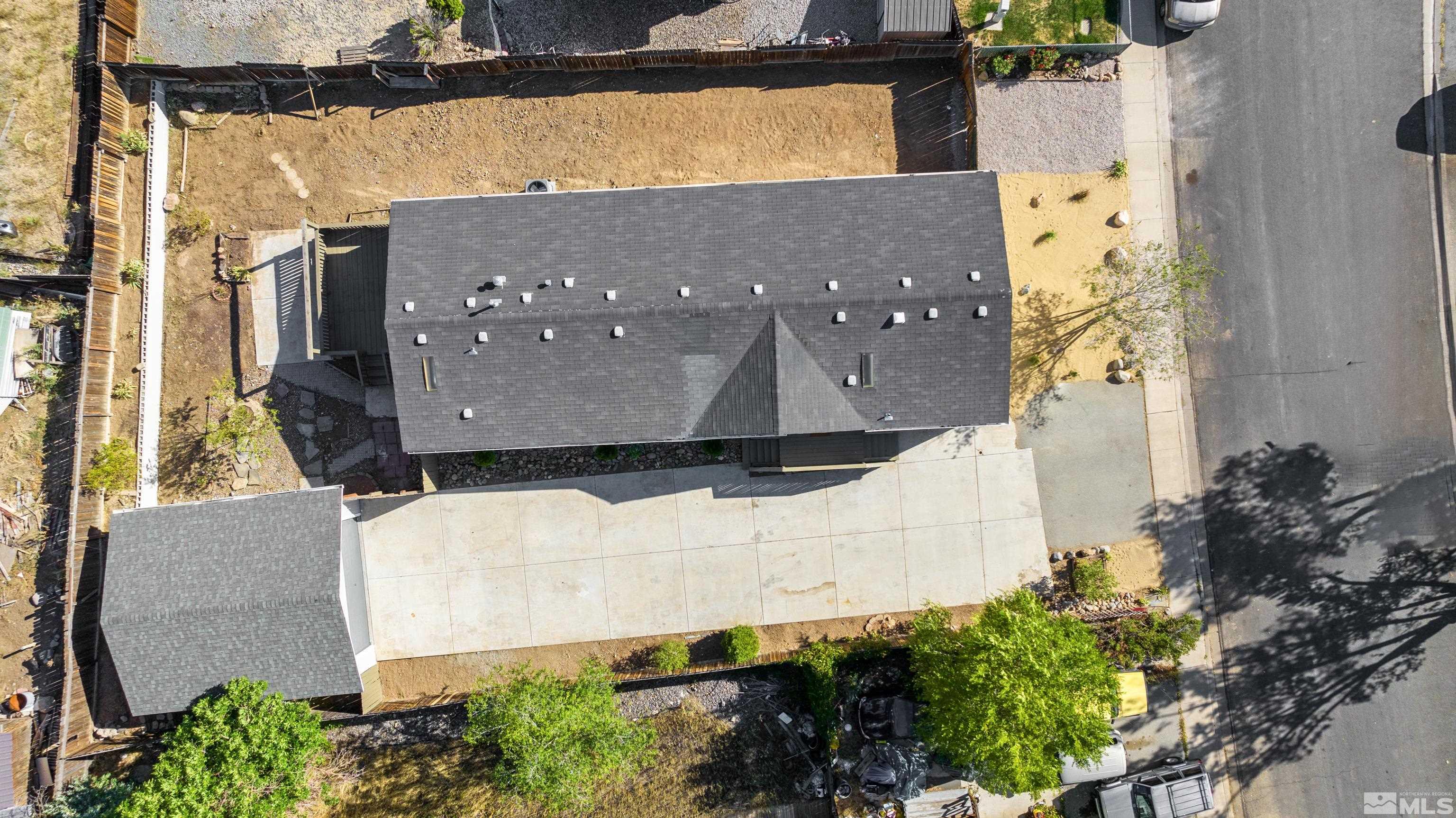 7640 Lytton Road Reno, NV 89506 - Photo 2 of 40 an aerial view of a house with a yard and large tree