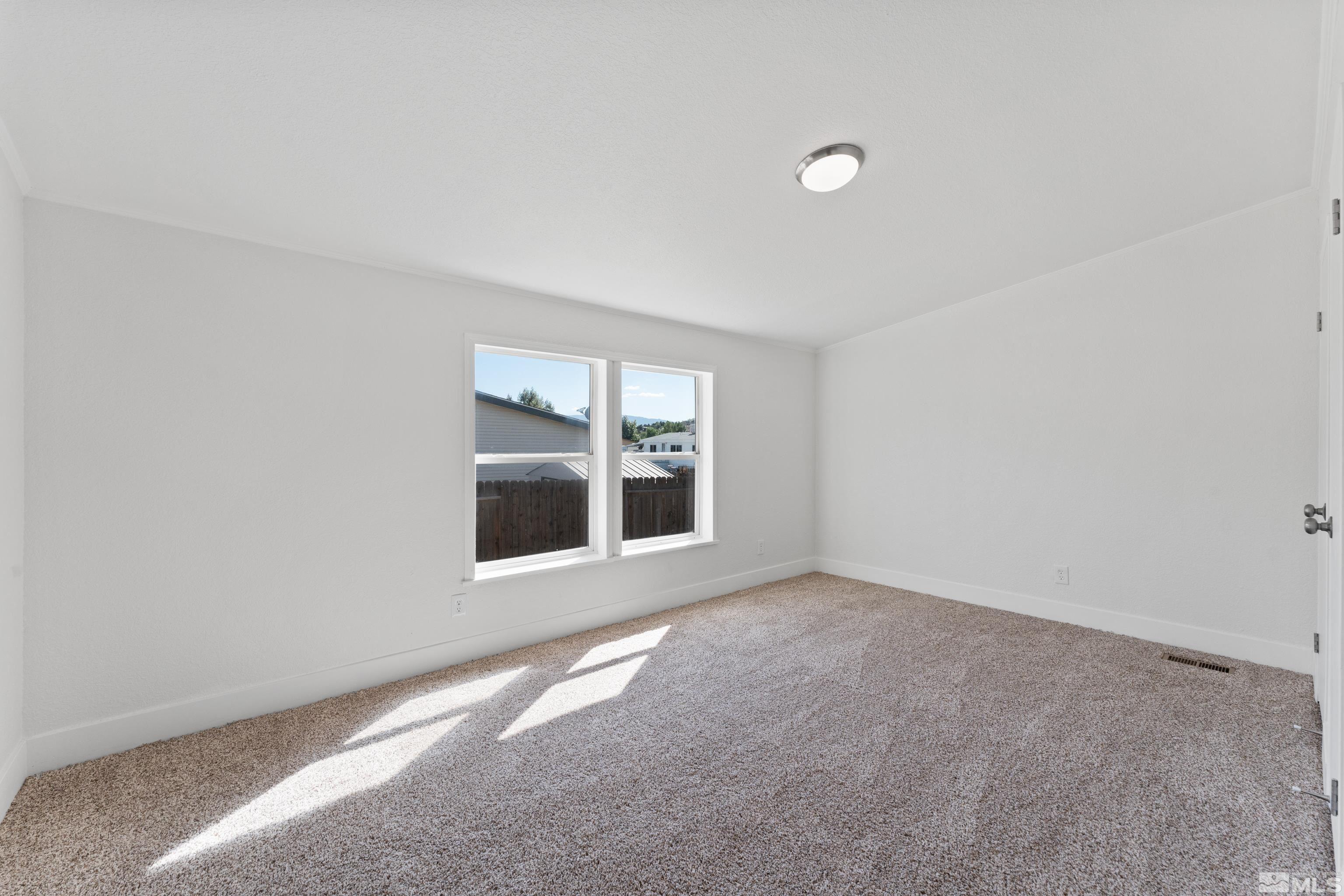 7640 Lytton Road Reno, NV 89506 - Photo 22 of 40 an empty room with a window