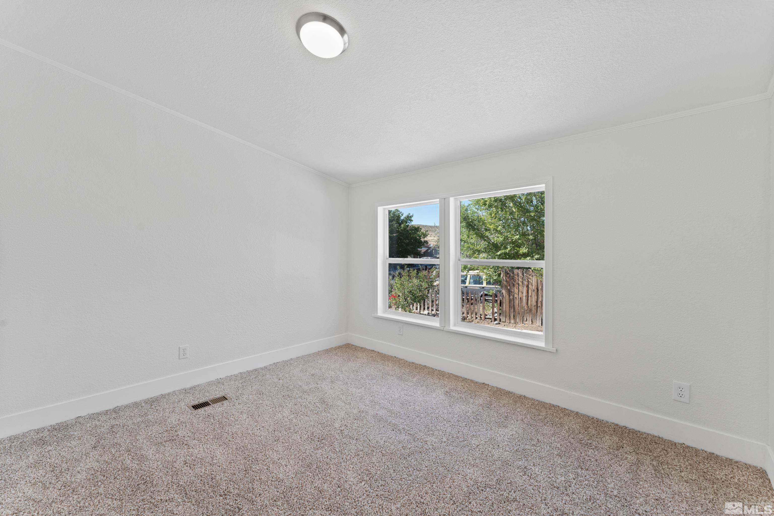 7640 Lytton Road Reno, NV 89506 - Photo 25 of 40 an empty room with windows