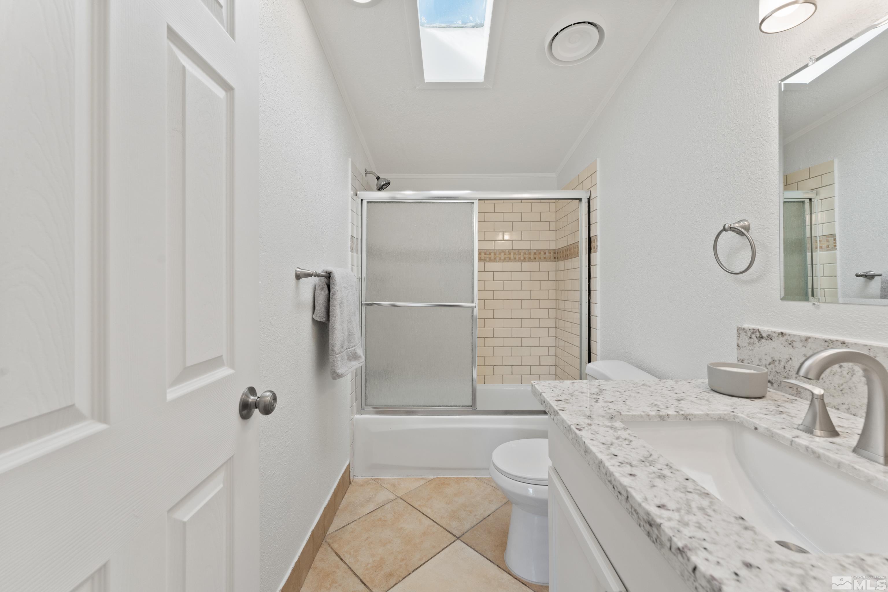 7640 Lytton Road Reno, NV 89506 - Photo 30 of 40 a bathroom with a sink a toilet and shower