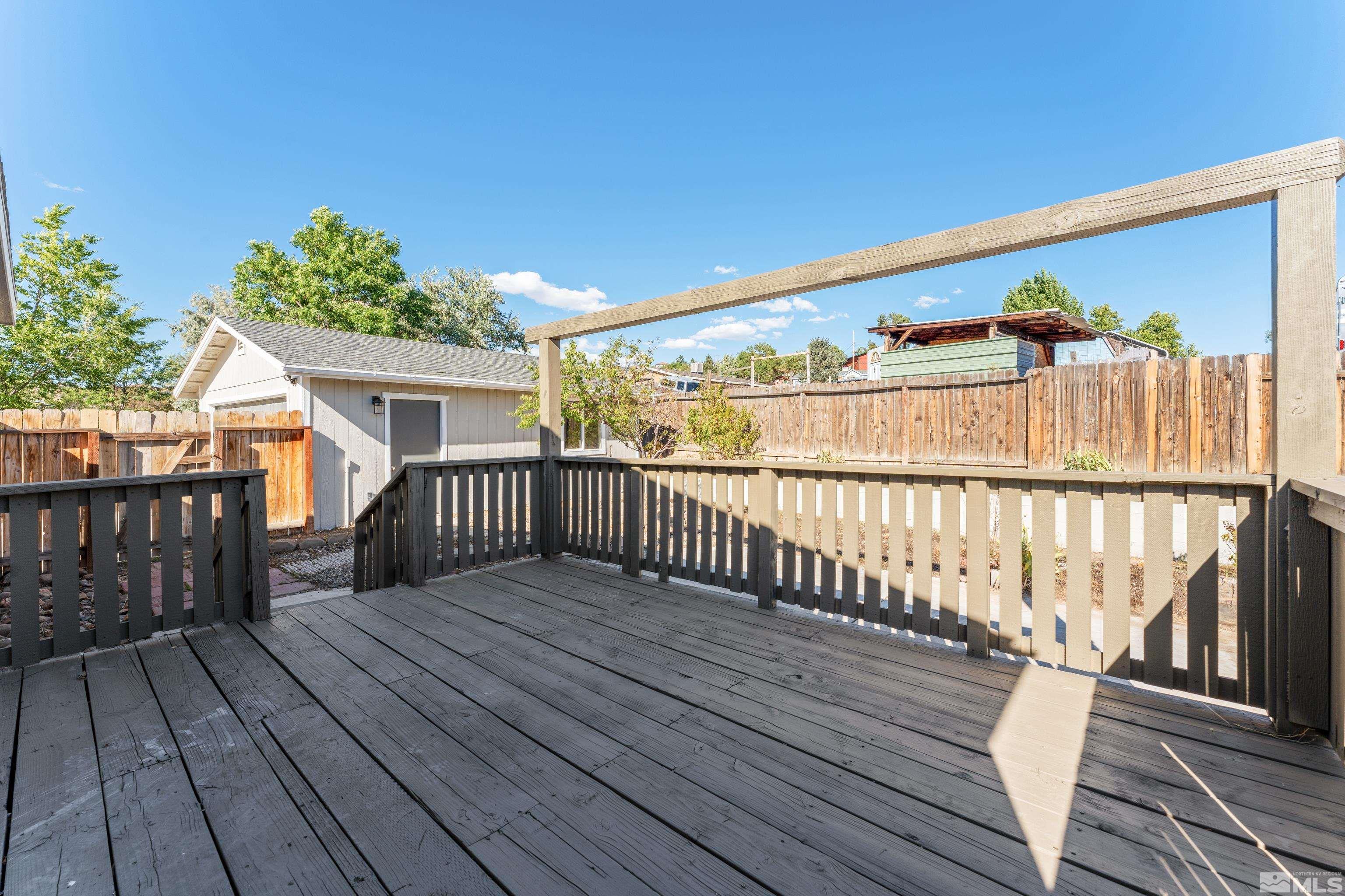7640 Lytton Road Reno, NV 89506 - Photo 34 of 40 a view of a wooden deck with a yard