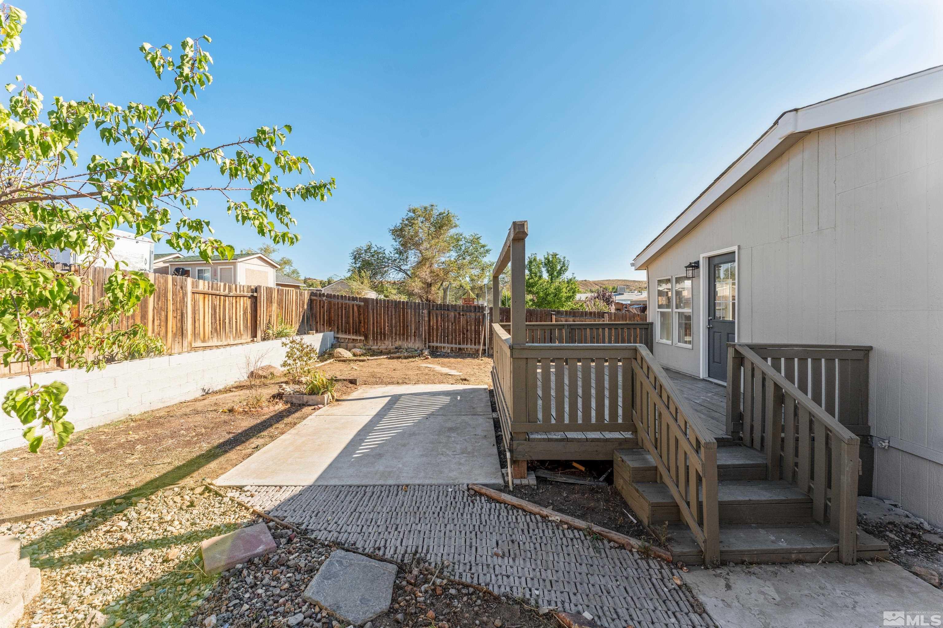 7640 Lytton Road Reno, NV 89506 - Photo 35 of 40 a view of balcony with wooden floor and outdoor seating