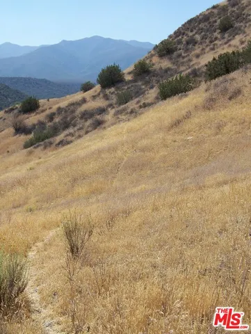 a view of road and mountains