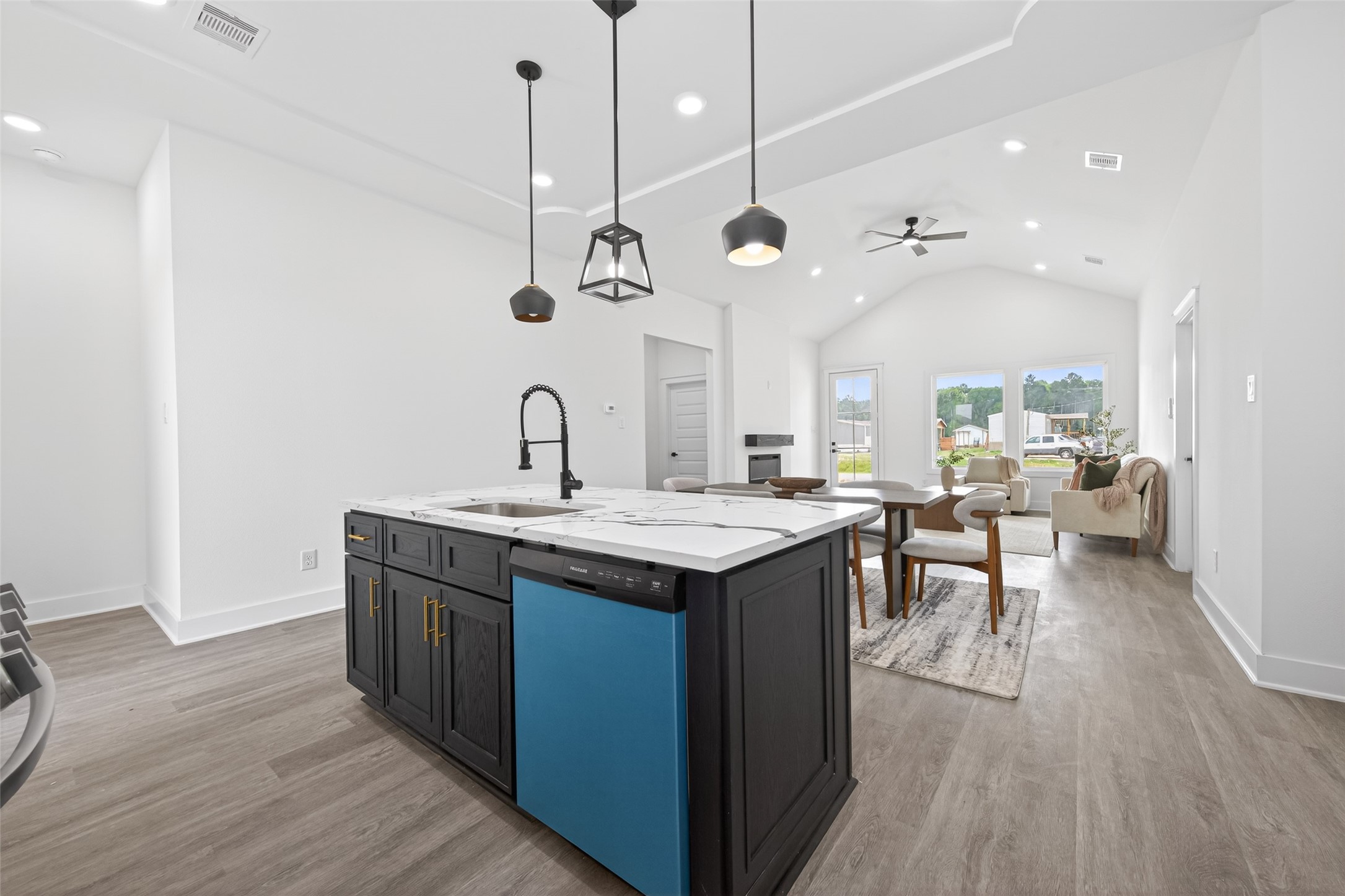 1129 Longleaf Pne Street Huffman, TX 77336 - Photo 11 of 35 a kitchen with a sink a counter space and wooden floor