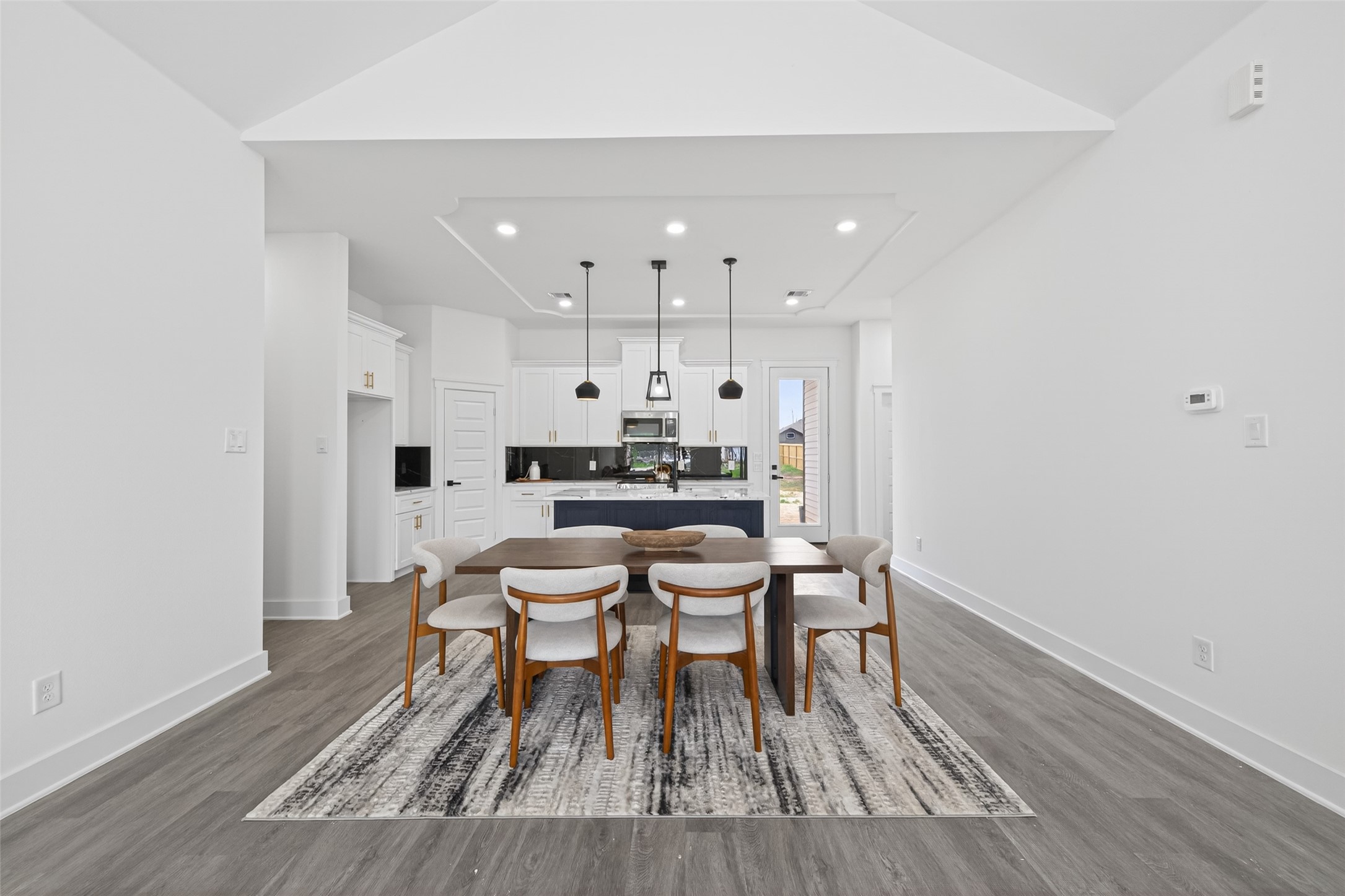1129 Longleaf Pne Street Huffman, TX 77336 - Photo 14 of 35 a dining room with furniture and wooden floor
