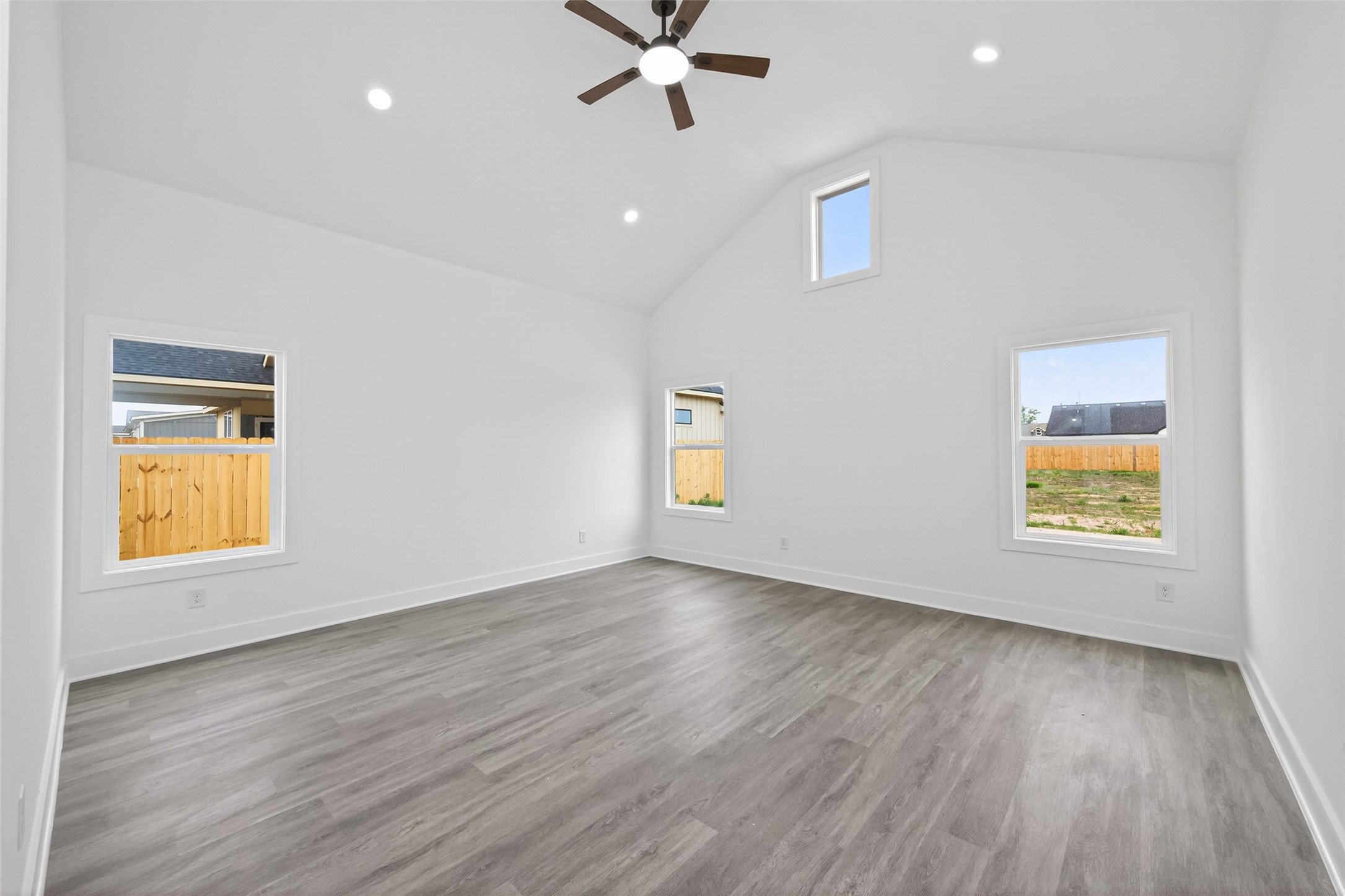 1129 Longleaf Pne Street Huffman, TX 77336 - Photo 17 of 35 wooden floor in an empty room with a window