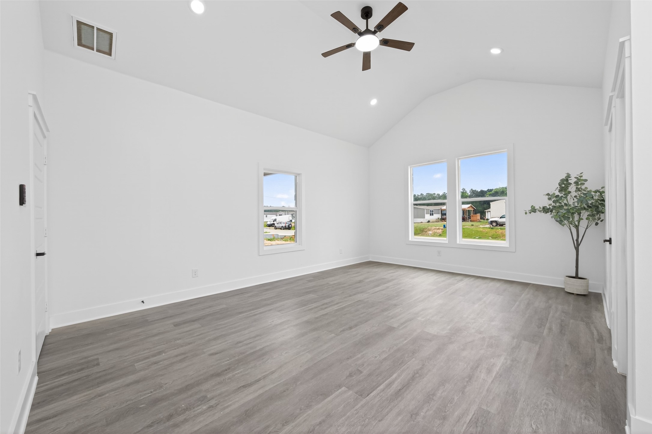 1129 Longleaf Pne Street Huffman, TX 77336 - Photo 21 of 35 wooden floor in an empty room with a window