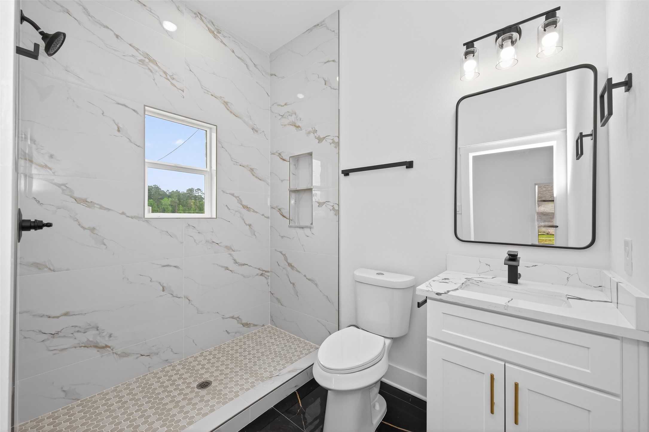 1129 Longleaf Pne Street Huffman, TX 77336 - Photo 24 of 35 a bathroom with a sink toilet and shower
