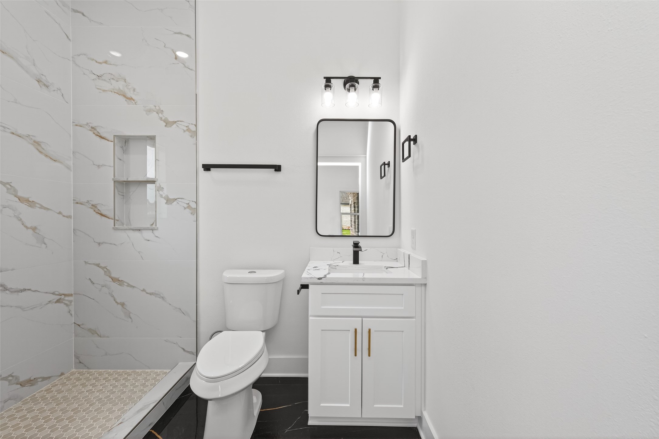 1129 Longleaf Pne Street Huffman, TX 77336 - Photo 25 of 35 a bathroom with a toilet sink and mirror