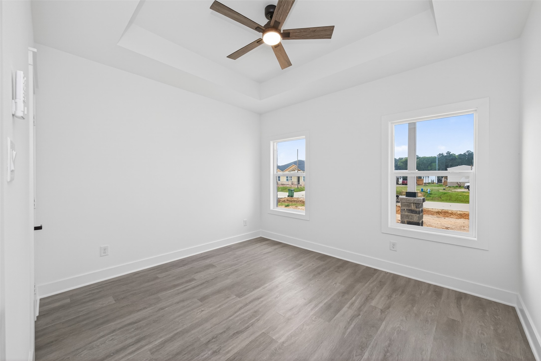 1129 Longleaf Pne Street Huffman, TX 77336 - Photo 27 of 35 wooden floor in an empty room with a window