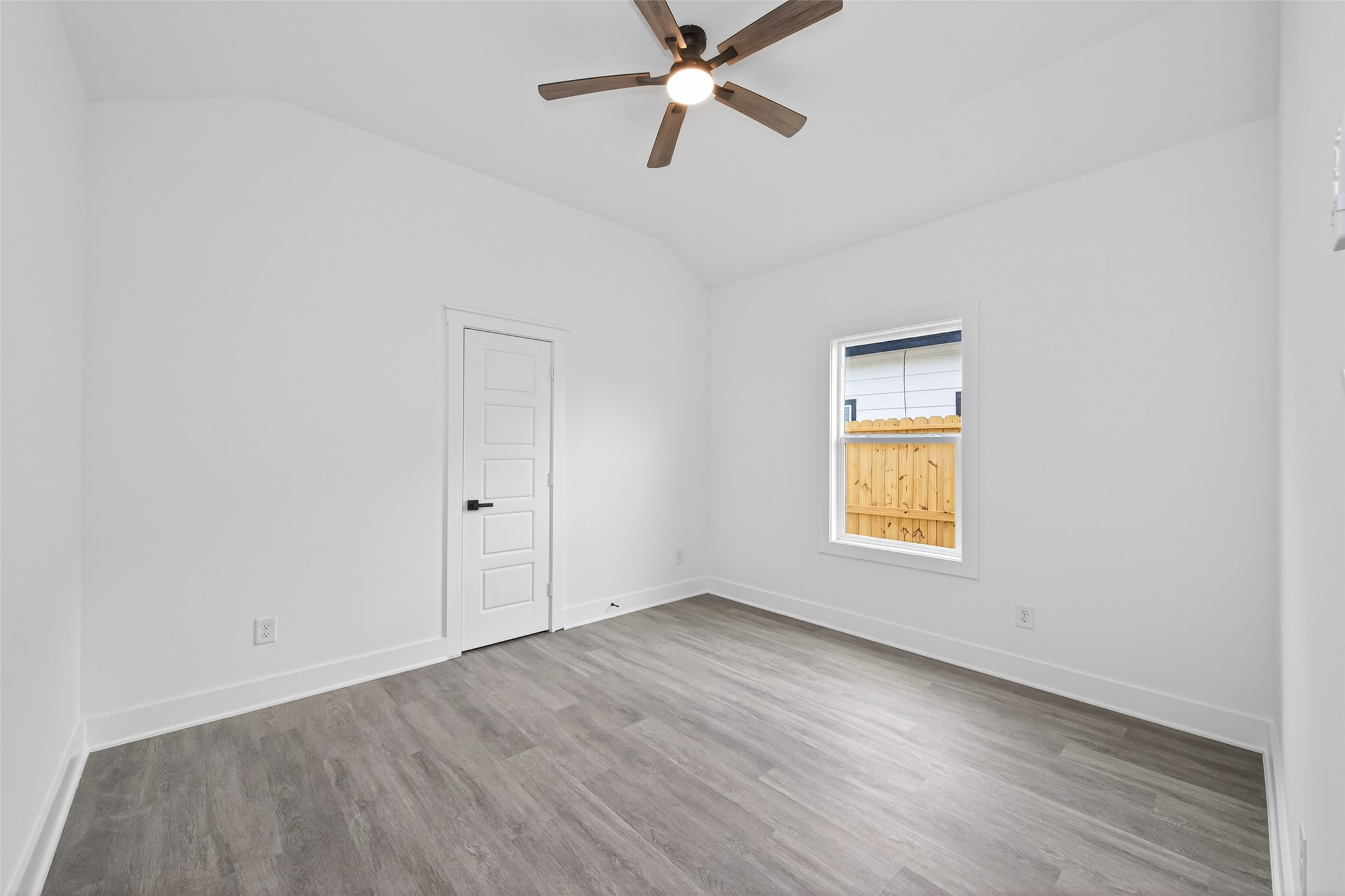 1129 Longleaf Pne Street Huffman, TX 77336 - Photo 28 of 35 an empty room with a window and a ceiling fan