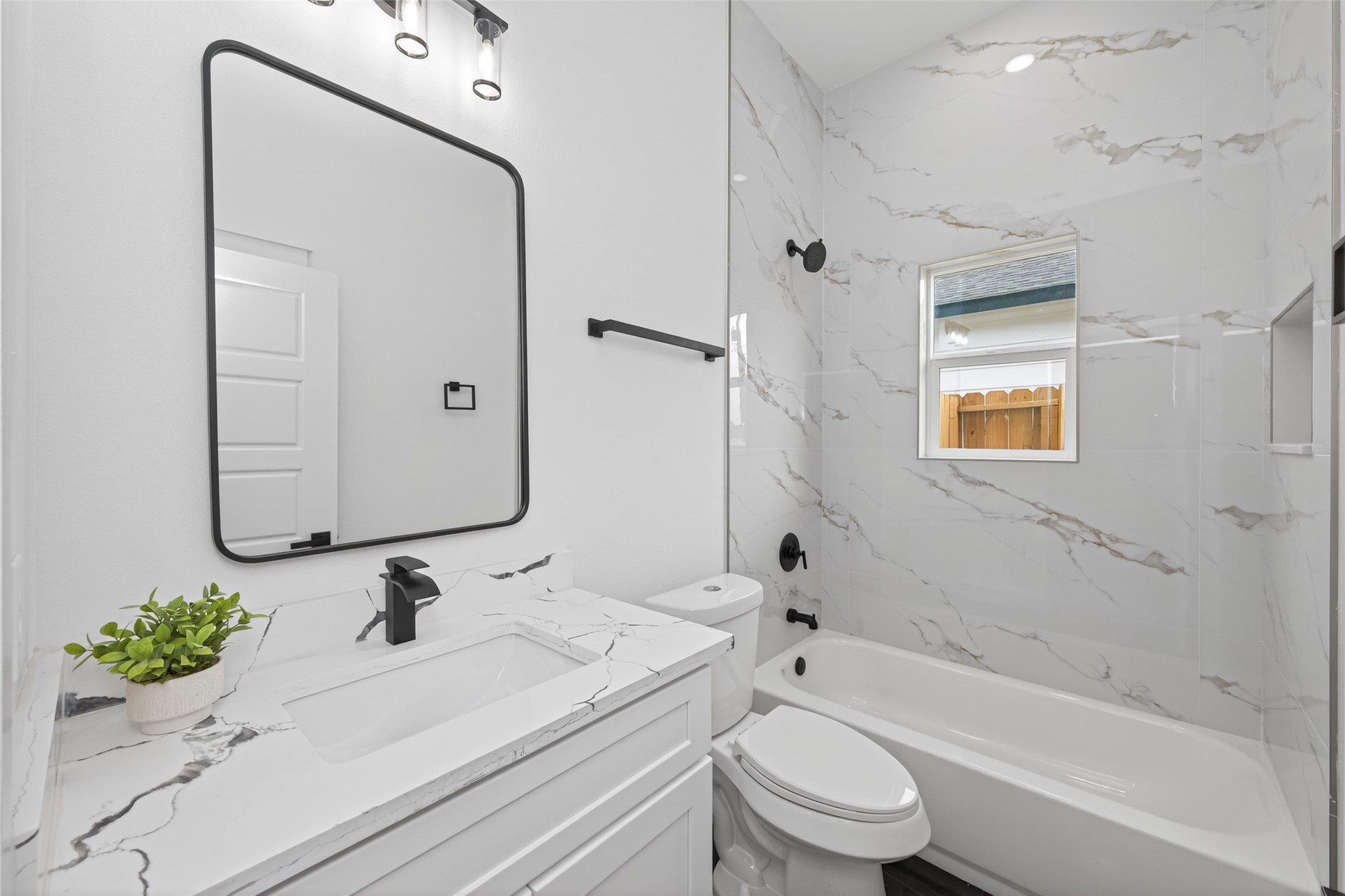 1129 Longleaf Pne Street Huffman, TX 77336 - Photo 30 of 35 a bathroom with a sink mirror toilet and bathtub