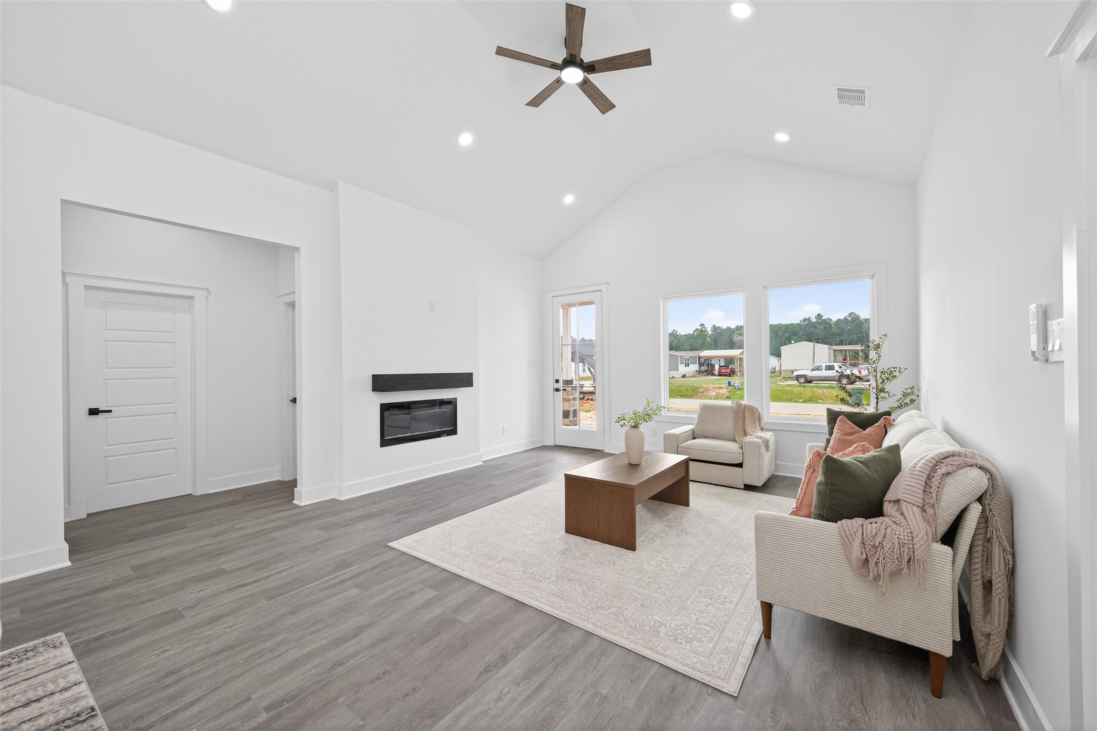 1129 Longleaf Pne Street Huffman, TX 77336 - Photo 3 of 35 a living room with furniture wooden floor and a large window