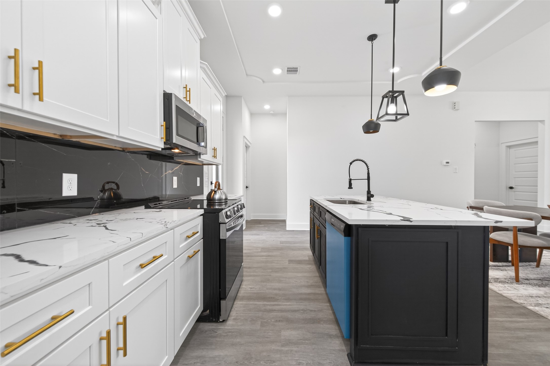 1129 Longleaf Pne Street Huffman, TX 77336 - Photo 9 of 35 a kitchen with a sink and a refrigerator