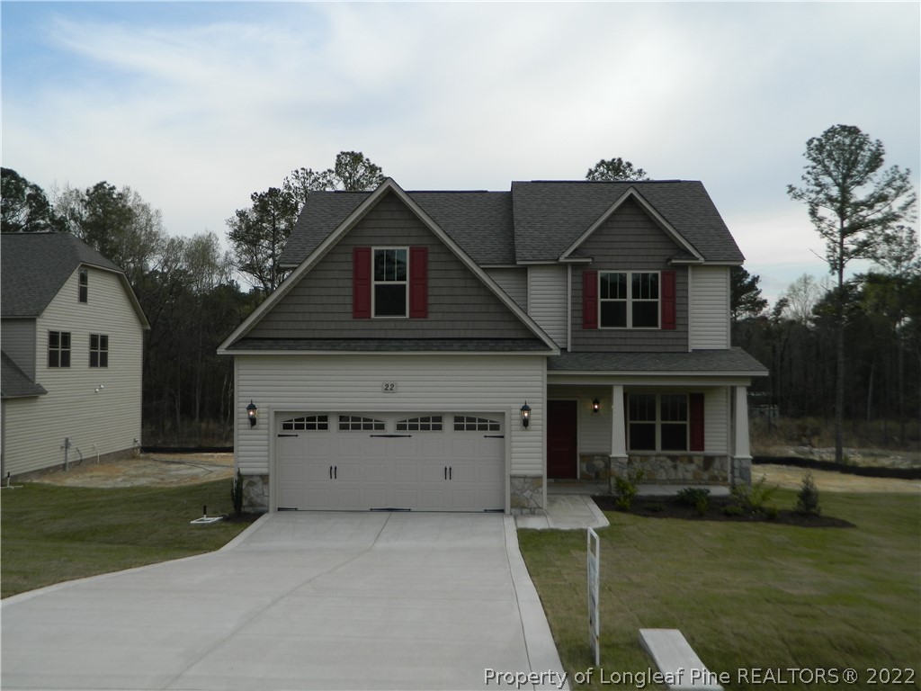 22 Raintree Lane Spring Lake, NC 28390 - Photo 1 of 33 front view of a house with a yard