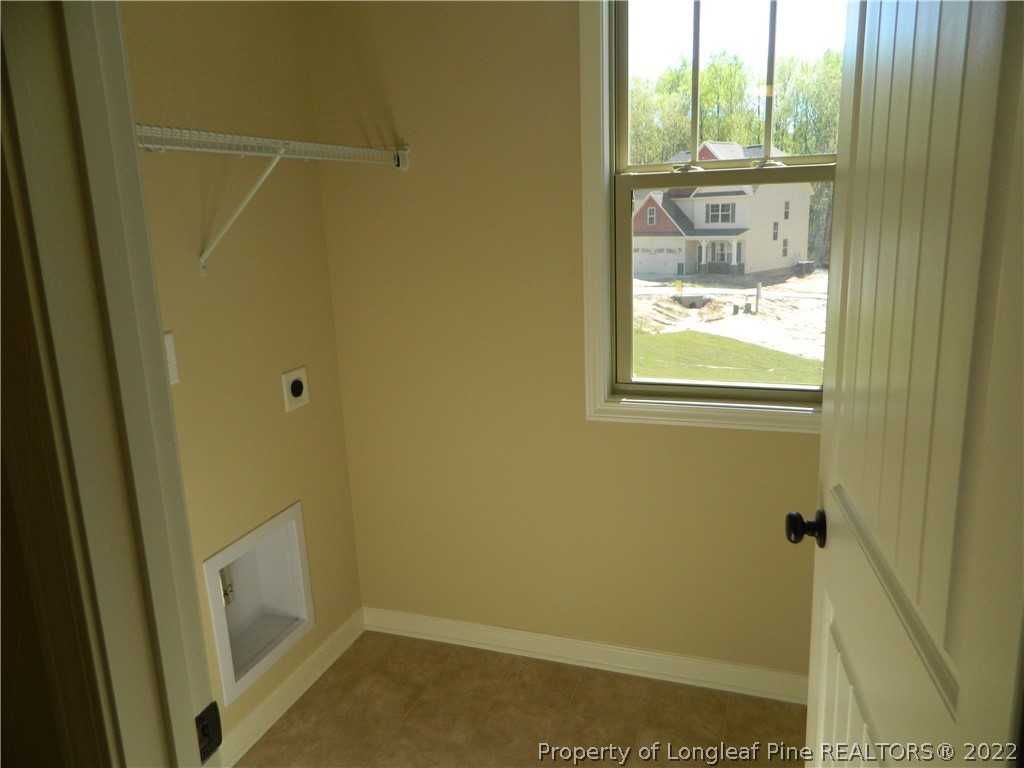 22 Raintree Lane Spring Lake, NC 28390 - Photo 16 of 33 a bathroom that has a window in it