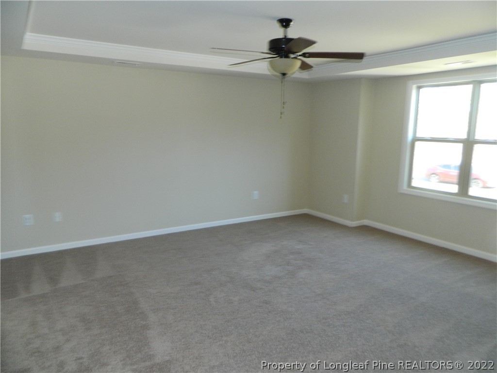 22 Raintree Lane Spring Lake, NC 28390 - Photo 18 of 33 an empty room with a window and a fan