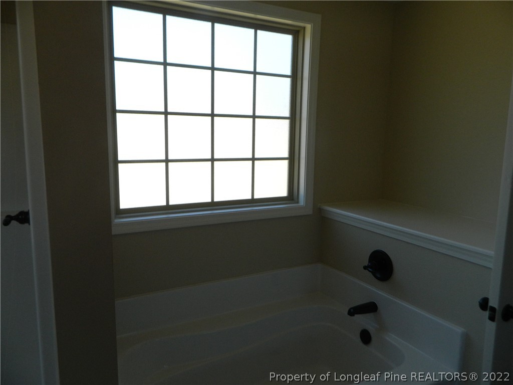 22 Raintree Lane Spring Lake, NC 28390 - Photo 20 of 33 a bathroom with a window