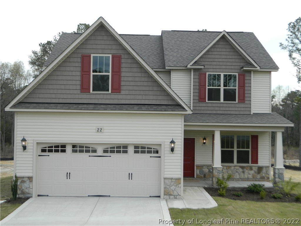22 Raintree Lane Spring Lake, NC 28390 - Photo 2 of 33 a view of a house with a yard