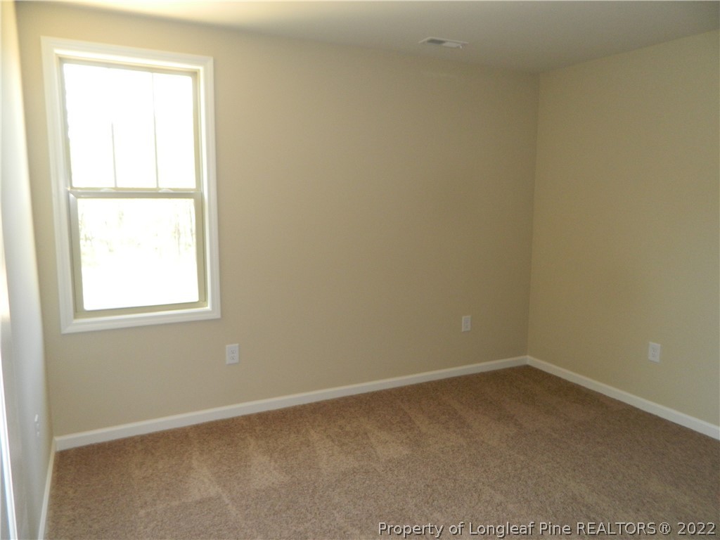 22 Raintree Lane Spring Lake, NC 28390 - Photo 27 of 33 an empty room with a window