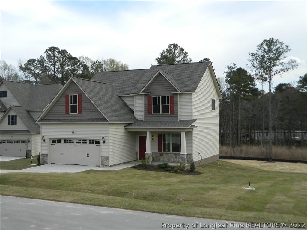 22 Raintree Lane Spring Lake, NC 28390 - Photo 3 of 33 front view of a house with a yard