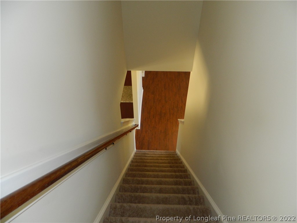 22 Raintree Lane Spring Lake, NC 28390 - Photo 31 of 33 a view of a hallway with wooden floor