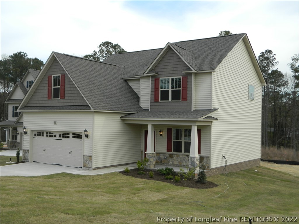 22 Raintree Lane Spring Lake, NC 28390 - Photo 5 of 33 a front view of a house with a yard
