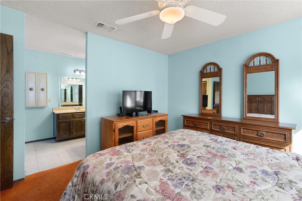 3518 Chestnut Drive Norco, CA 92860 - Photo 12 of 38 a bedroom with a bed and a television