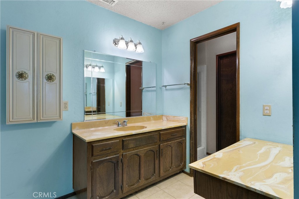 3518 Chestnut Drive Norco, CA 92860 - Photo 13 of 38 a bathroom with a sink and a mirror