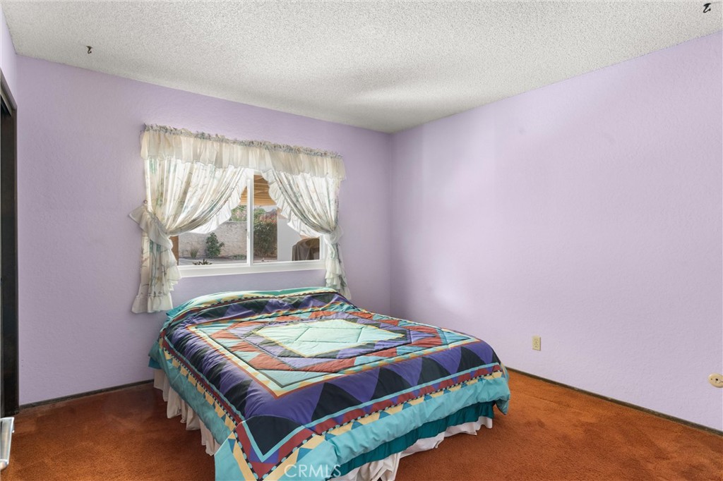 3518 Chestnut Drive Norco, CA 92860 - Photo 15 of 38 a bedroom with a bed and a window