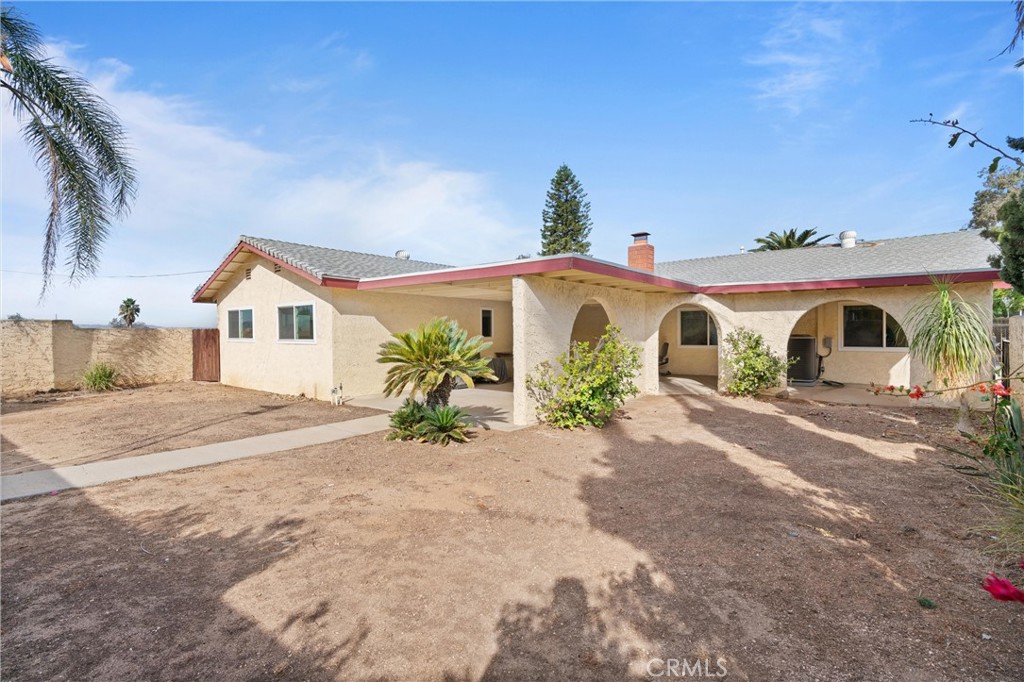 3518 Chestnut Drive Norco, CA 92860 - Photo 18 of 38 a view of a house with a yard and potted plants