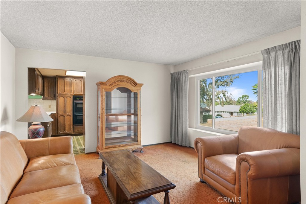 3518 Chestnut Drive Norco, CA 92860 - Photo 3 of 38 a living room with furniture and a large window