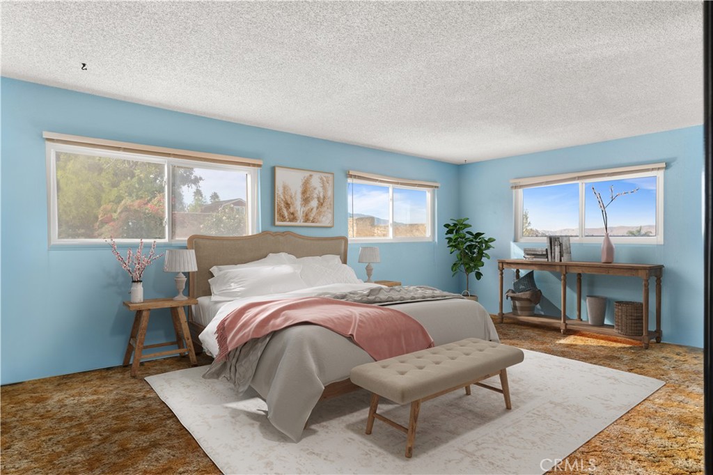 3518 Chestnut Drive Norco, CA 92860 - Photo 4 of 38 a bed room with a bed and a fireplace