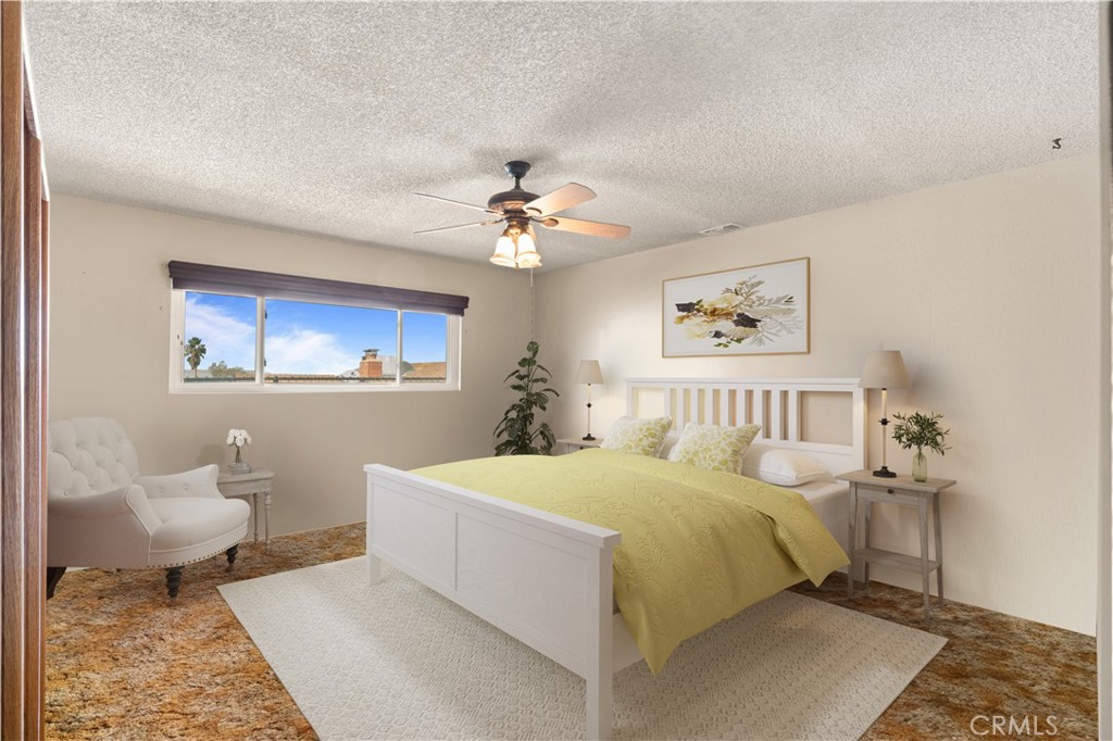 3518 Chestnut Drive Norco, CA 92860 - Photo 5 of 38 a bedroom with a white bed and a chandelier