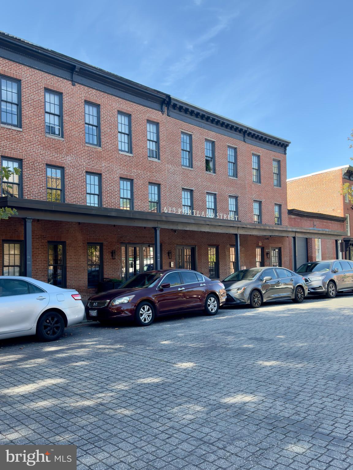 a cars parked in front of a building