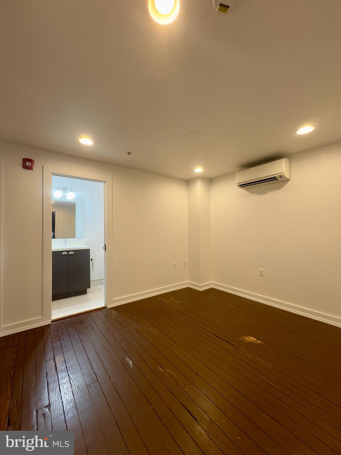 613 Portland Street, Unit 11 Baltimore, MD 21230 - Photo 6 of 9 a view of a room with wooden floor and natural light