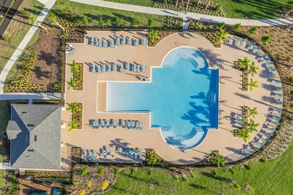 an aerial view of a house with swimming pool